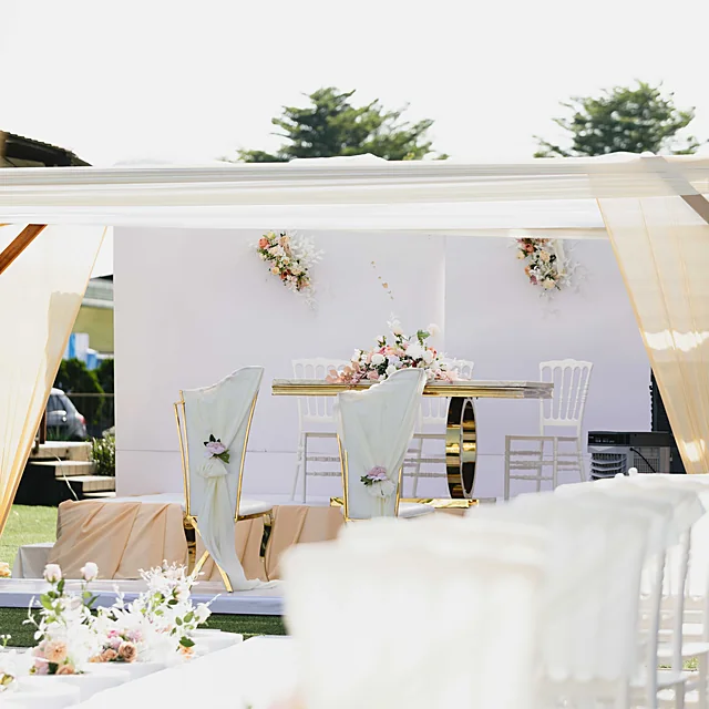 Modern bridal reception styling with tailored lounge settings and statement floral decor